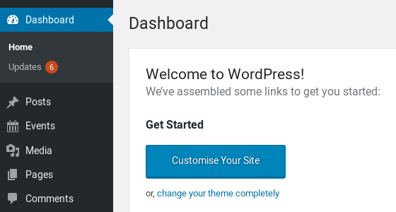 A screenshot of the WordPress Administrator Dashboard. In the top left corner just under the Home label there is another label Updates and an orange circle with the digit six in it showing how many updates are available.