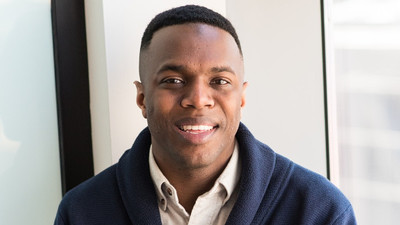 image of man wearing blue button up sweater